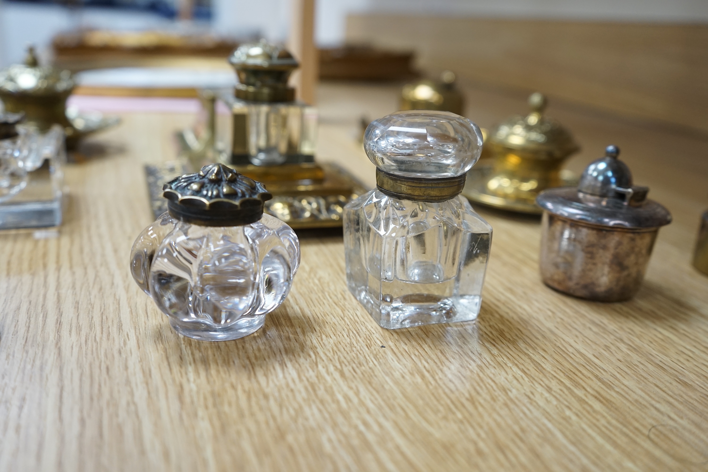 Eleven various 19th century and later inkwells, mostly brass. Condition varies